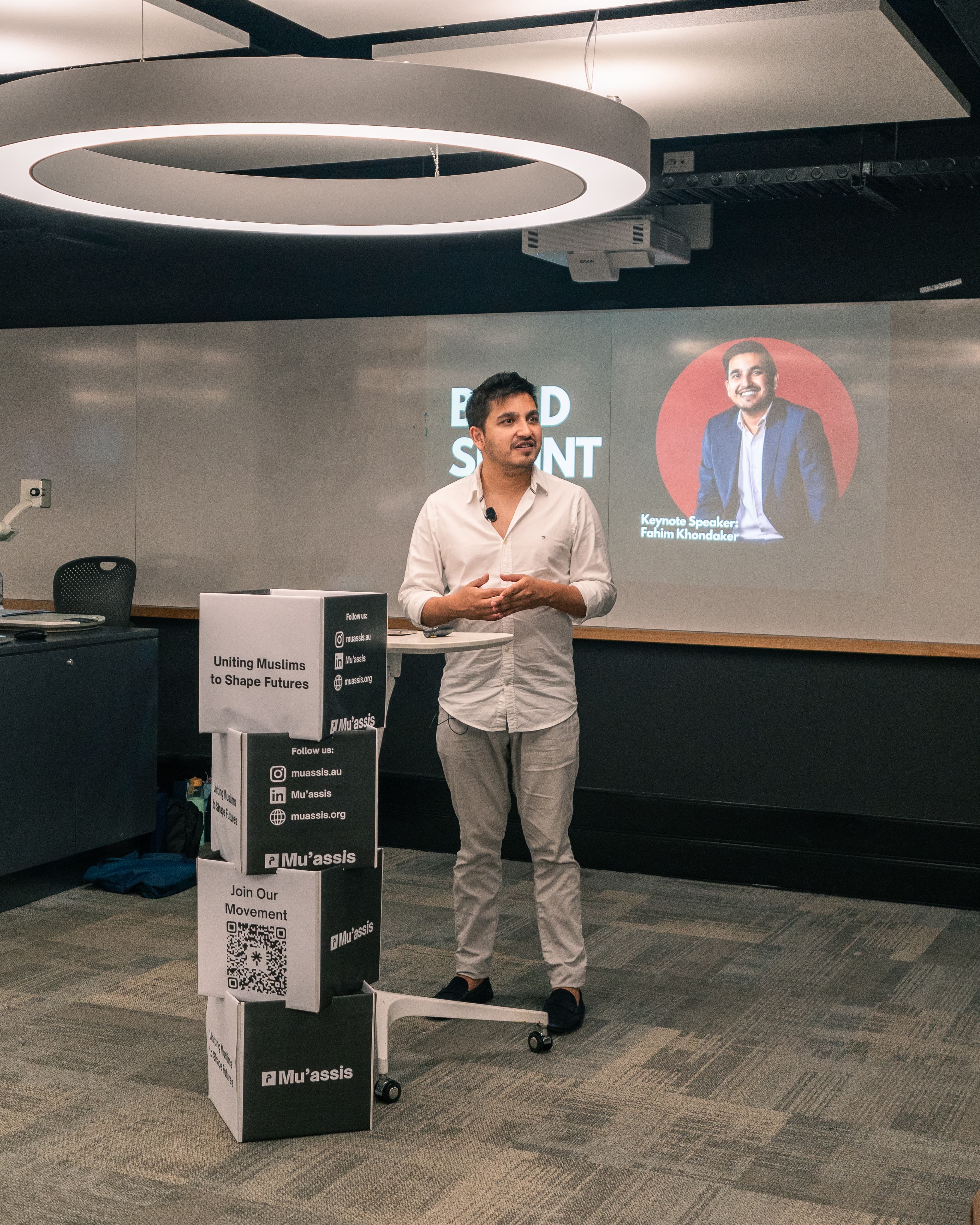 Group discussion with laptops and notebooks.