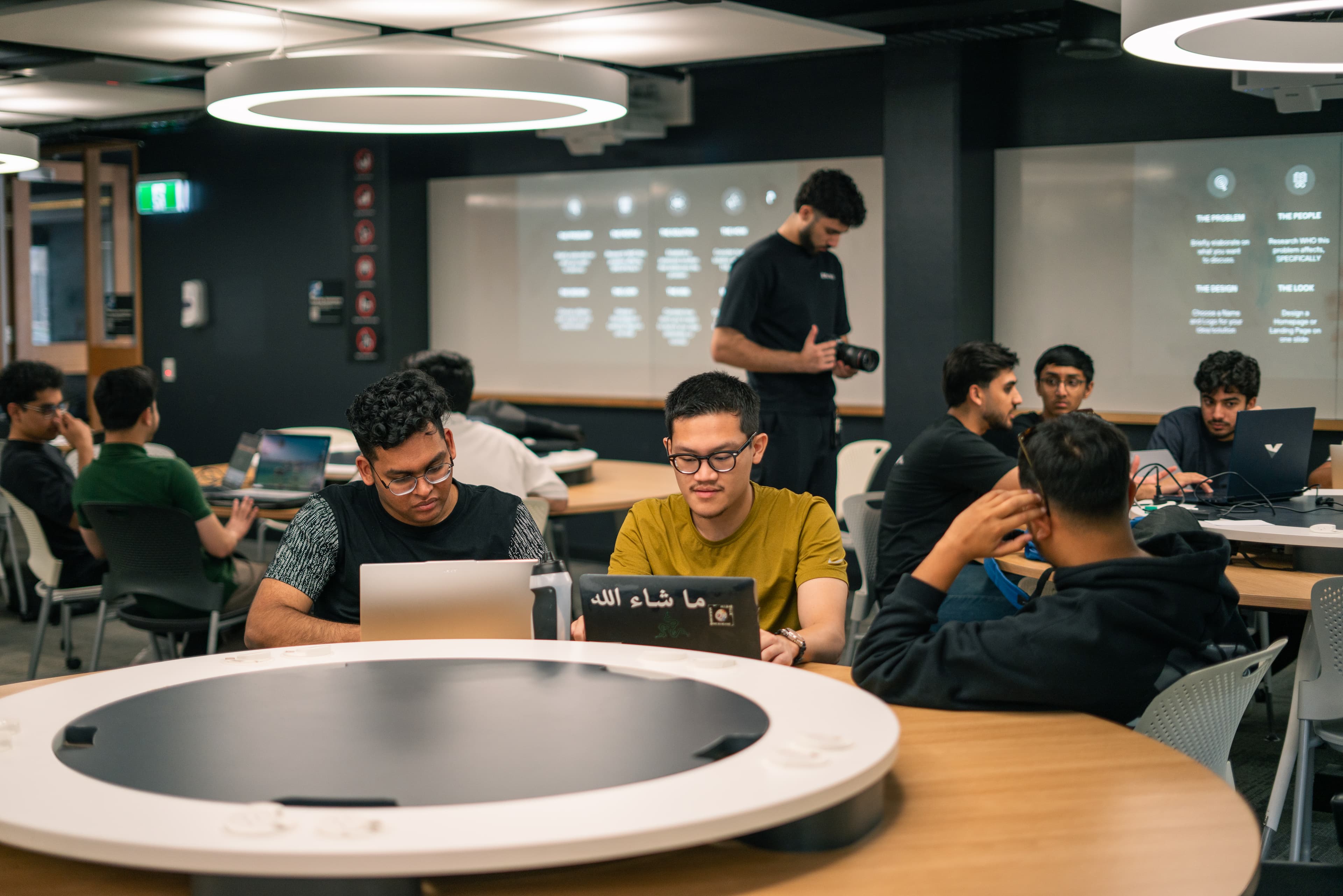 Founder presenting ideas to a small team.